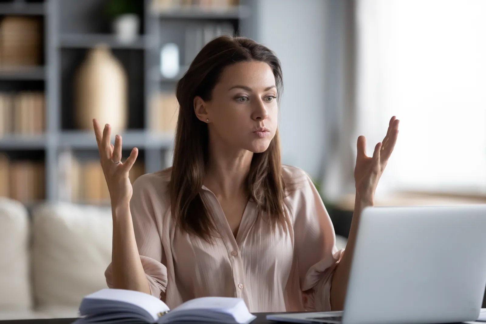 A woman sitting in front of a laptop