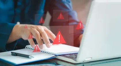 a hand holding a card